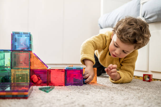 boy playing with building blocks